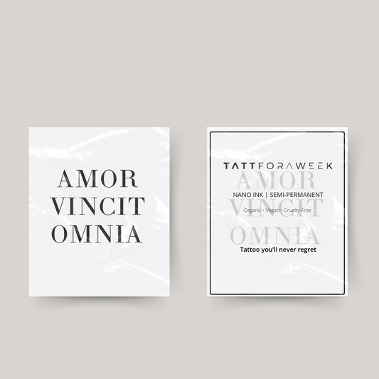 Tatuaggio temporaneo amor vincit omnia